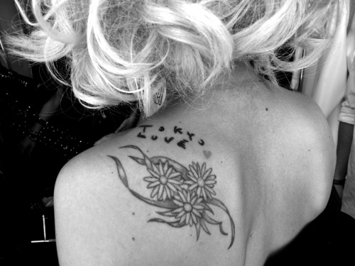 Lady Gaga showing off her new Tokyo Love tattoo designed for her by Nobuyoshi Araki, on the set of the shoot for her Fame Kills tour poster shoot with photographer Hanna Liden at Milk Studios, New York. Photo Rachel Chandler